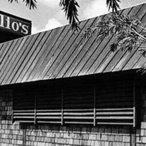 A black and white photo of the front of a restaurant.