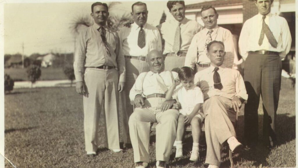 A group of men in suits and ties posing for the camera.