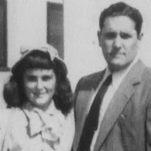 A man and woman standing next to each other.